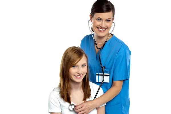 Young patient being examined by a cheerful doctor — Stock Photo, Image
