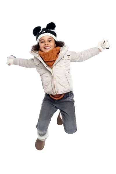 Excited primary girl jumping with joy — Stock Photo, Image