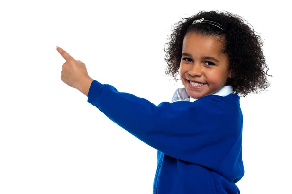 Adorable African kid pointing at copy space area — Stock Photo, Image