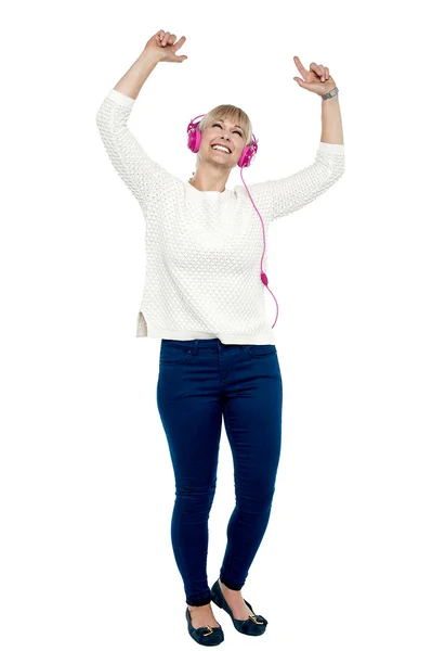 Joyous middle aged woman dancing to the beat — Stock Photo, Image