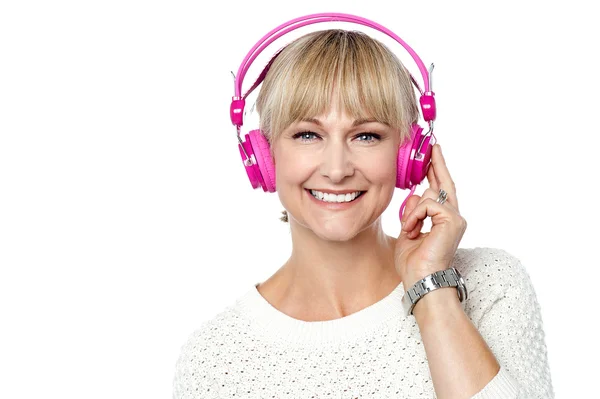 Portrait of a cheerful woman with headphones on — Stock Photo, Image