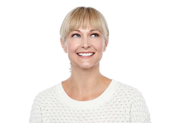 Snap shot of a smiling blonde looking upwards — Stock Photo, Image