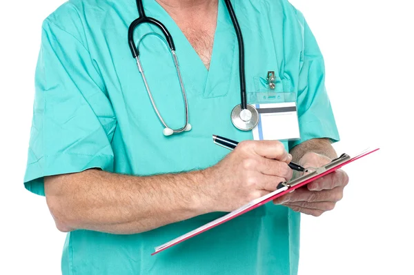 Medical expert jotting down case sheet notes — Stock Photo, Image