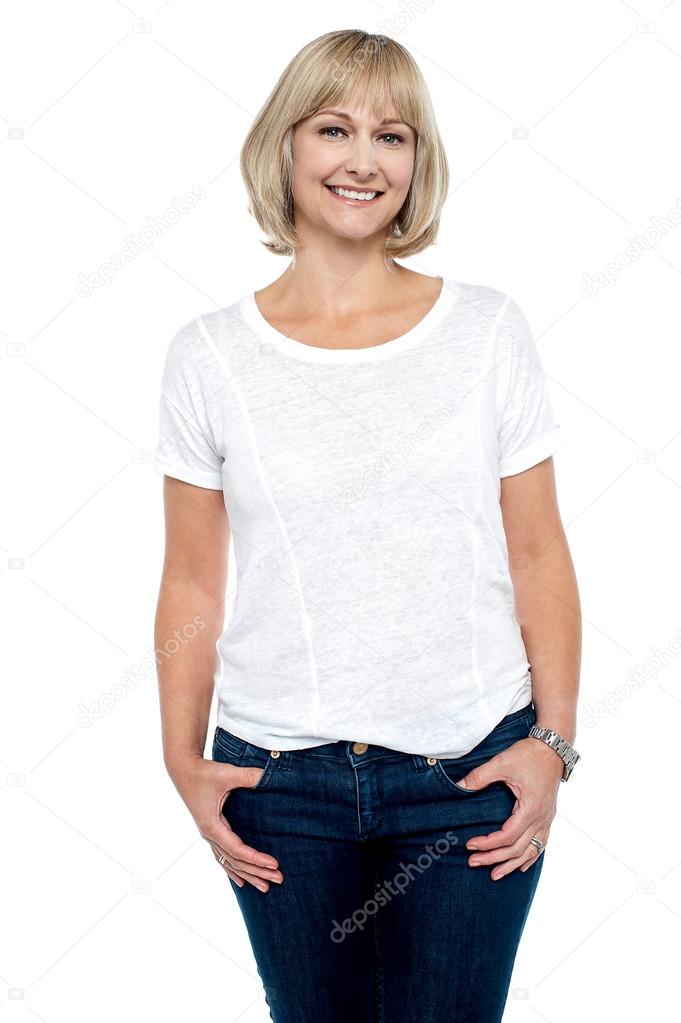 Middle aged woman in trendy clothing smiling at you