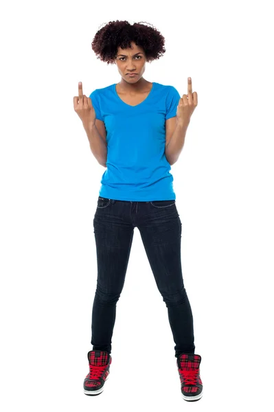 Annoyed young female showing middle finger — Stock Photo, Image