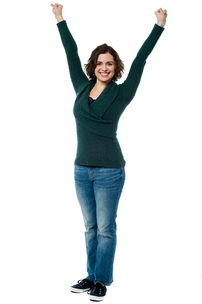 Jubilant woman with raised arms celebrating victory — Stock Photo, Image