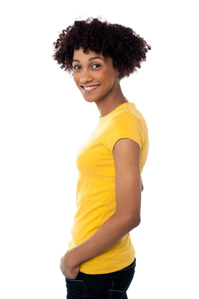 Pretty woman wearing yellow top and jeans — Stock Photo, Image