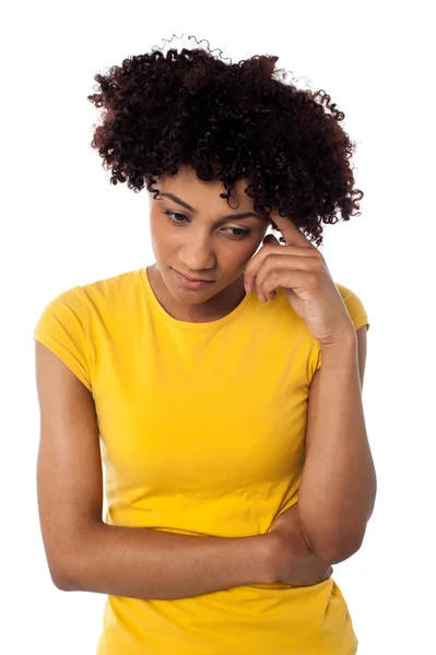 Calm and thoughtful curly haired young woman Stock Picture
