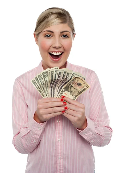 Attractive young woman holding money — Stock Photo, Image