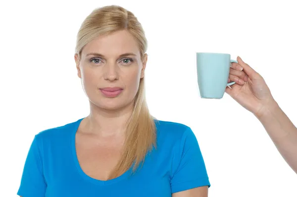 Woman is being offered a cup of beverage — Stock Photo, Image