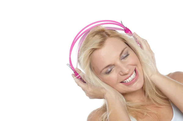 Tilted shot of a blonde engrossed in music — Stock Photo, Image