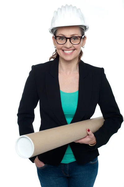 Confident female architect carrying blueprints — Stock Photo, Image