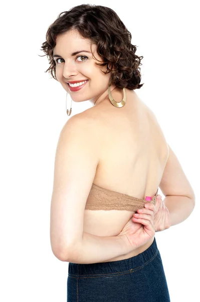 Beautiful model wants to remove bra — Stock Photo, Image