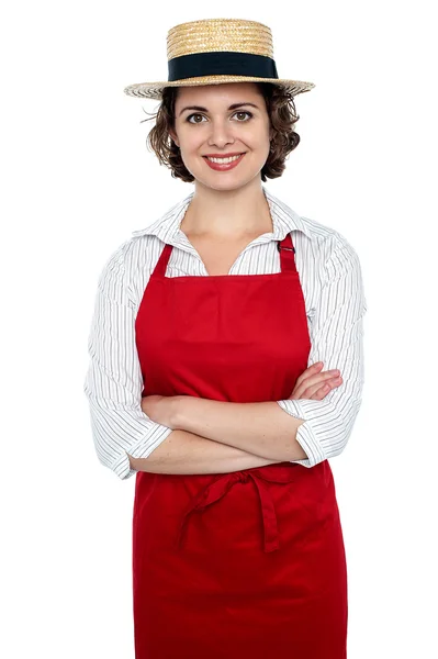 Cheerful baker woman wearing straw bowler hat — Stock Photo, Image