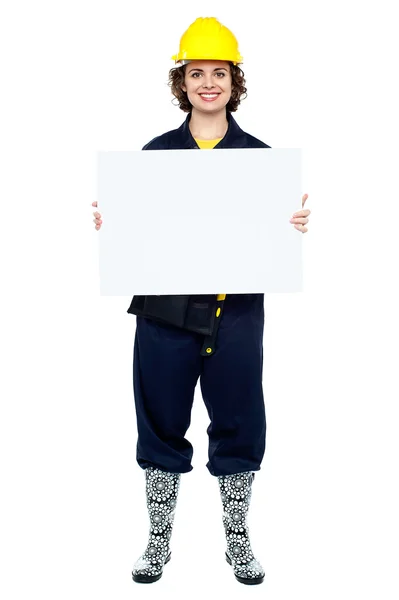 Active woman construction worker with empty blank of paper — Stock Photo, Image