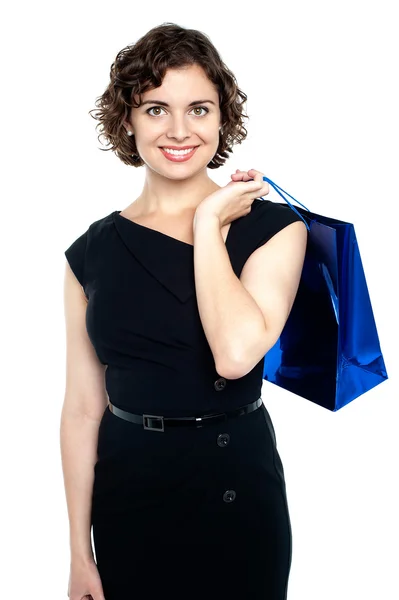 Shopaholic female holding shopping bag — Stock Photo, Image