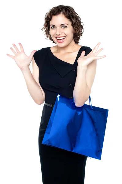 Shopaholic female holding shopping bag — Stock Photo, Image