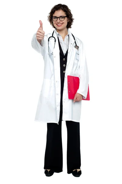 Smiling medical practitioner with thumb up — Stock Photo, Image