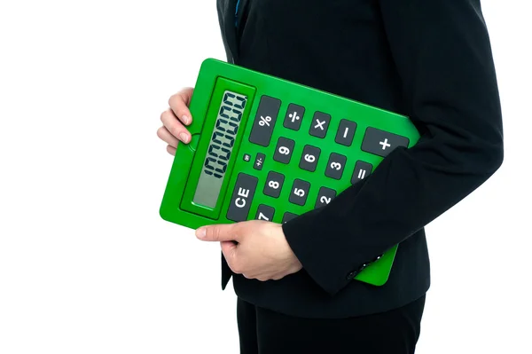 Confident corporate woman holding calculator — Stock Photo, Image