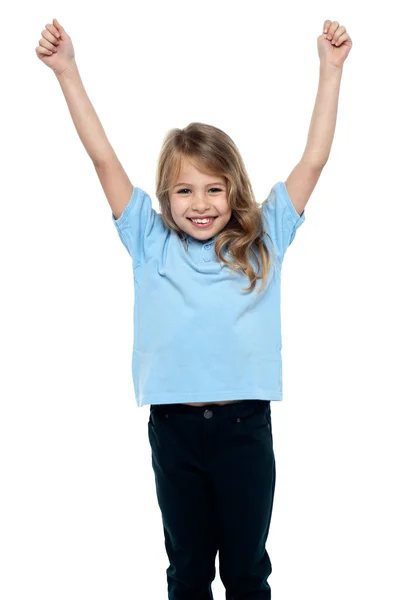 Cute caucasian girl celebrating with raised arms — Stock Photo, Image