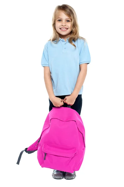 Happy little girl carrying school bag — Stock Photo, Image