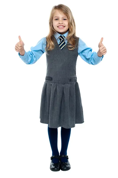 Bonito niño de la escuela mostrando pulgares hacia arriba gesto — Foto de Stock
