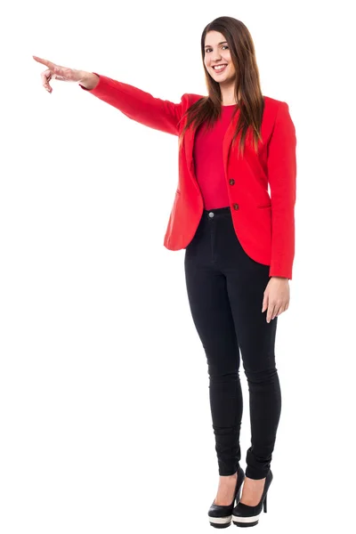 Charming young woman pointing away — Stock Photo, Image