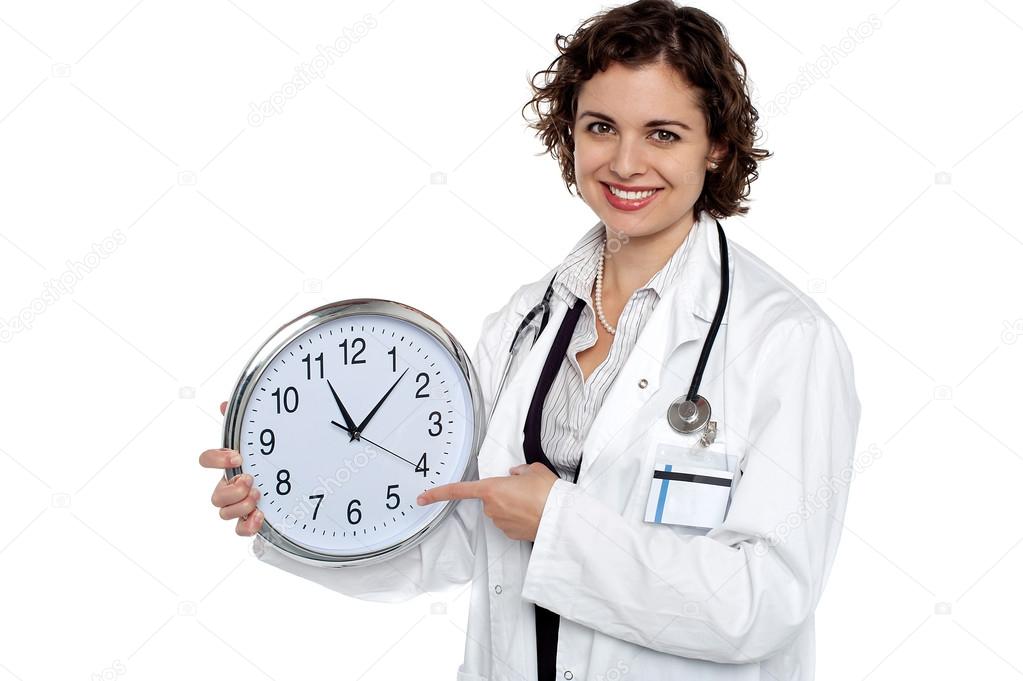 doctor holding a clock