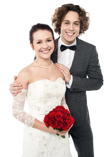 Excited groom embracing beautiful bride — Stock Photo, Image