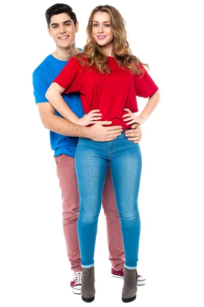 Guy embracing his girl from behind, arms around — Stock Photo, Image