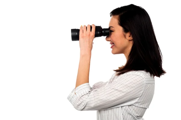 Corporate woman viewing through binoculars — Stock Photo, Image