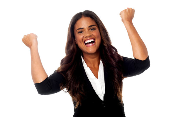 Excited woman with clenched fists