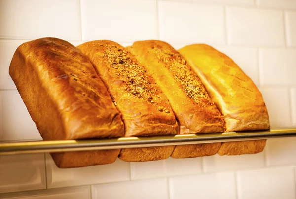 Freshly kneaded grain and white breads for sale — Stock Photo, Image