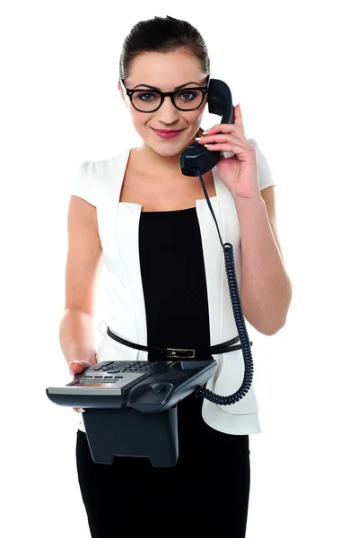 Bespectacles secretary answering a call — Stock Photo, Image