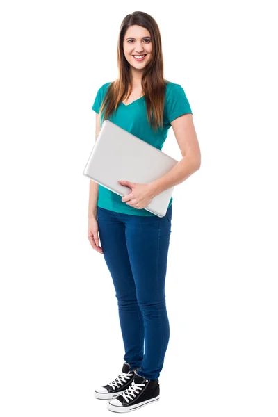 Casual attractive girl holding laptop — Stock Photo, Image