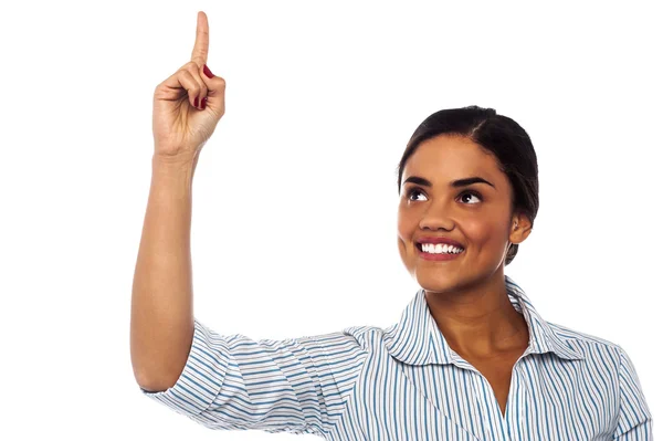 Corporate woman pointing upwards — Stock Photo, Image