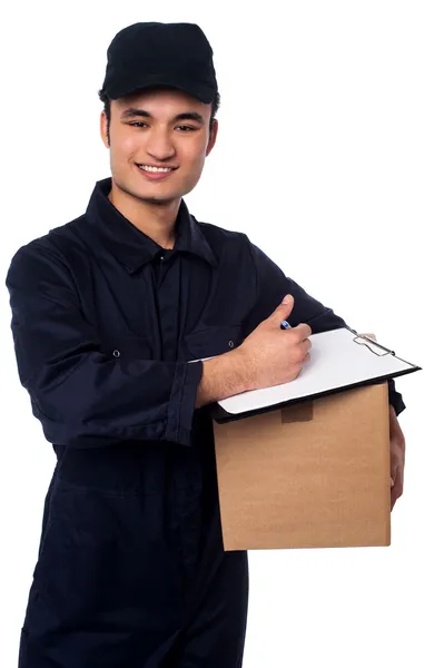 Smiling delivery man at your doorstep — Stock Photo, Image