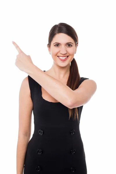 Young female pointing away — Stock Photo, Image