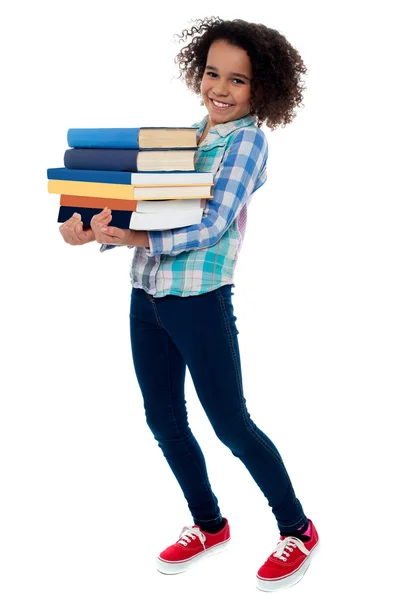 Niño activo de la escuela llevando libros — Foto de Stock