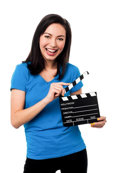 Young girl holding clapperboard — Stock Photo, Image