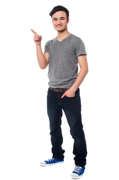 Young man pointing at something interesting — Stock Photo, Image