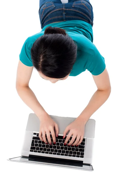 Aerial shot of a girl working on laptop — Stock Photo, Image