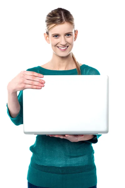 Young smiling girl holding laptop — Stock Photo, Image