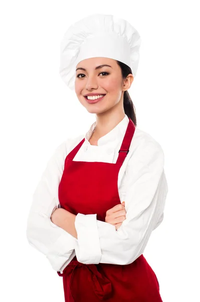 Alegre confiante jovem chef feminino — Fotografia de Stock