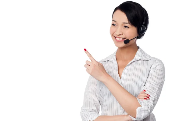 Customer support staff pointing away — Stock Photo, Image