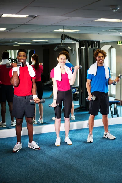 Group of doing biceps exercise — Stock Photo, Image