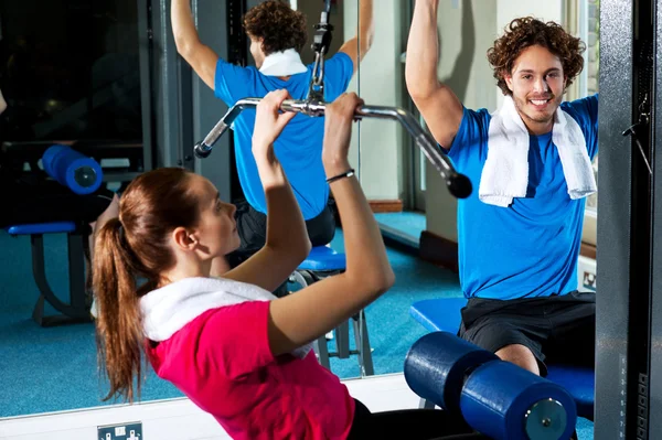 Man and woman in a fitness club — Stock Photo, Image