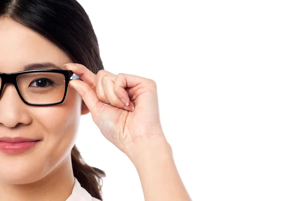Pretty girl adjusting her spectacles — Stock Photo, Image
