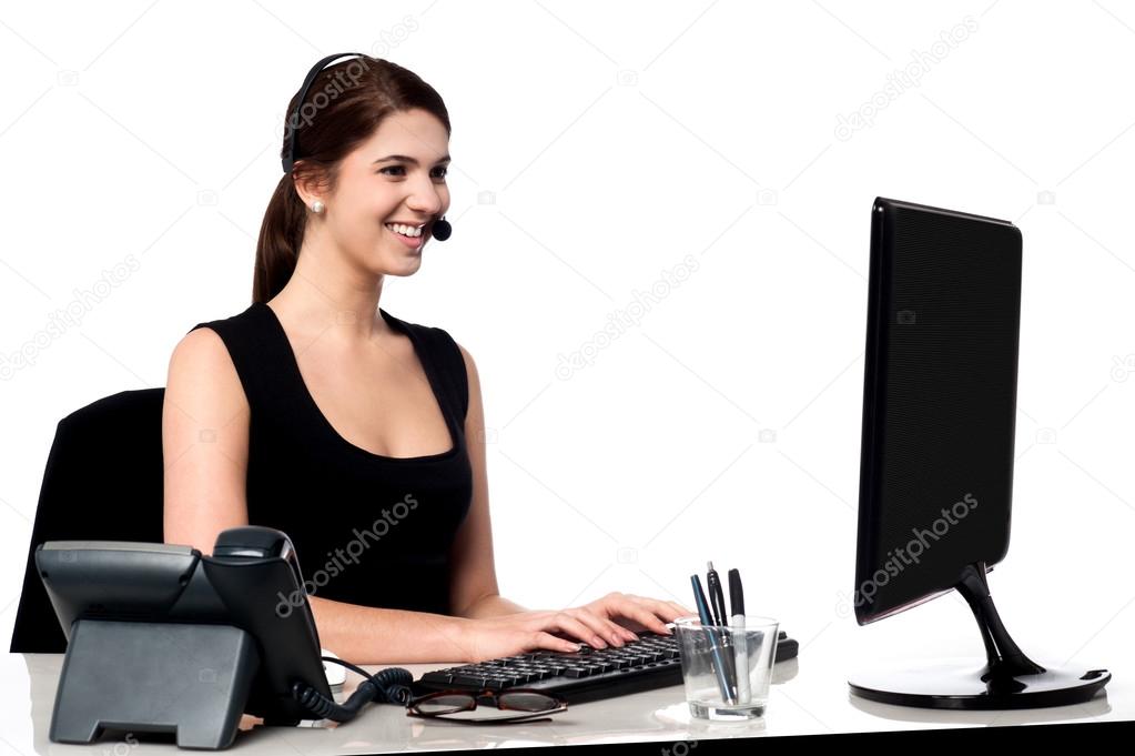 Call centre executive working on computer