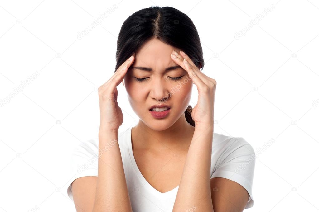 Young woman having headache